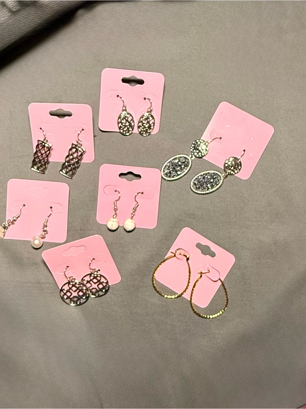 Lot of 7 pair of dangle earrings. Mixed styles and material.